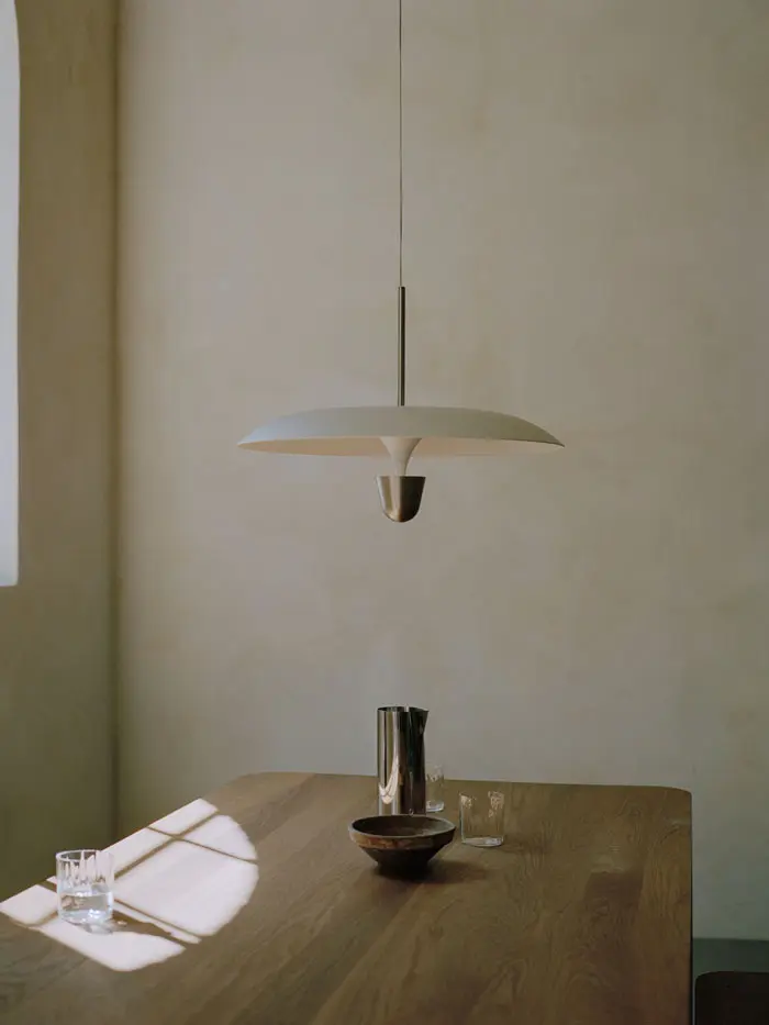 New-Works_Lifestyle_22121_Kantarell-Pendant-Lamp_Ø55_Nickel_11610_Pleat-Pitcher_42710_Atlas-Dining-Table_200x95_Natural-Oak_1.webp