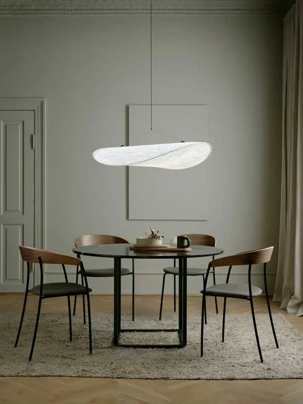 New-Works_Spring_2021_Florence-Dining-Table_Ø120_Black-Marquina_Missing-Chair_Walnut_Tense-Pendant_Ø90.webp