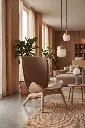 UMAGE_lifestyle_The-Reader_oak_sugar-brown_Paff_travertine_oak_Spring_pendant-lampshade_medium_large_brass_Spring_table-lamp_brass.webp
