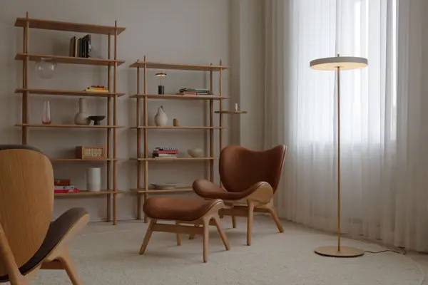 UMAGE_lifestyle_A-Conversation-Piece_low_ottoman_oak_cognac_(3).webp