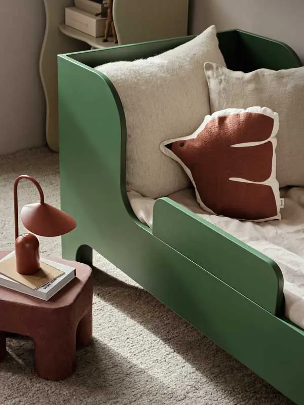 fermLIVING_SS24_SillJuniorBed_VerdantGreen_1104268751_SwifBirdCushion_BakedClay_1104268639_ArumPortableLamp_OxideRed_1104269286_1.webp